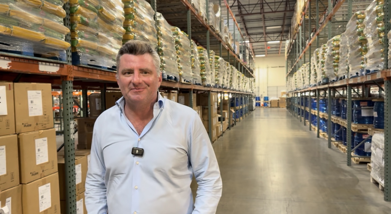 A Zeus Power Supplies team member standing in the company's warehouse